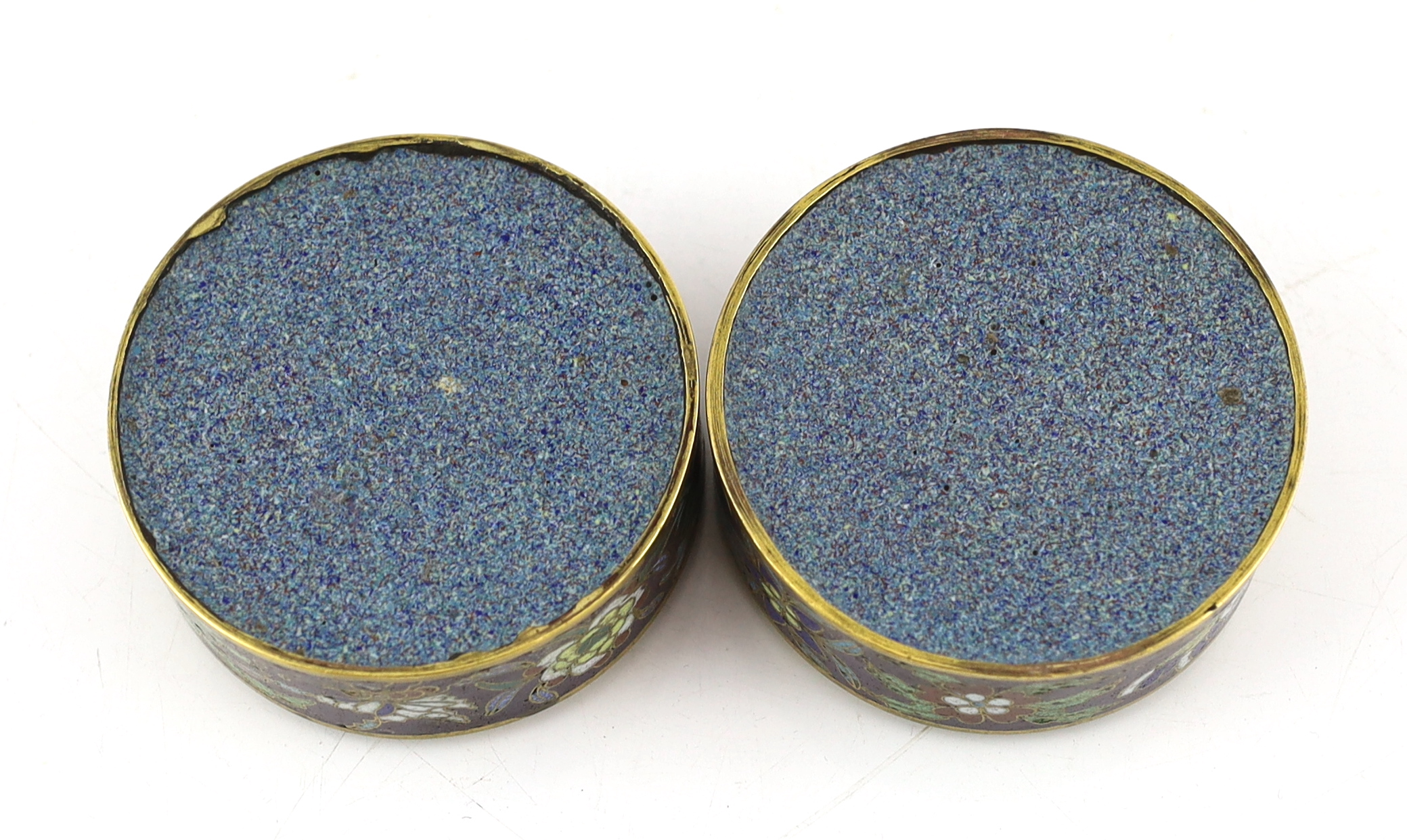 A pair of Chinese purple ground cloisonné enamel circular boxes and covers, 19th century, small losses enamel